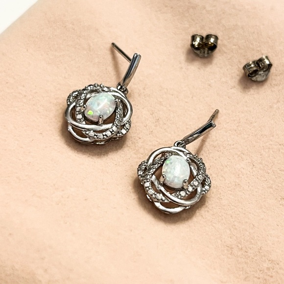 Lab created opals set in silver earrings. - Picture 3 of 6